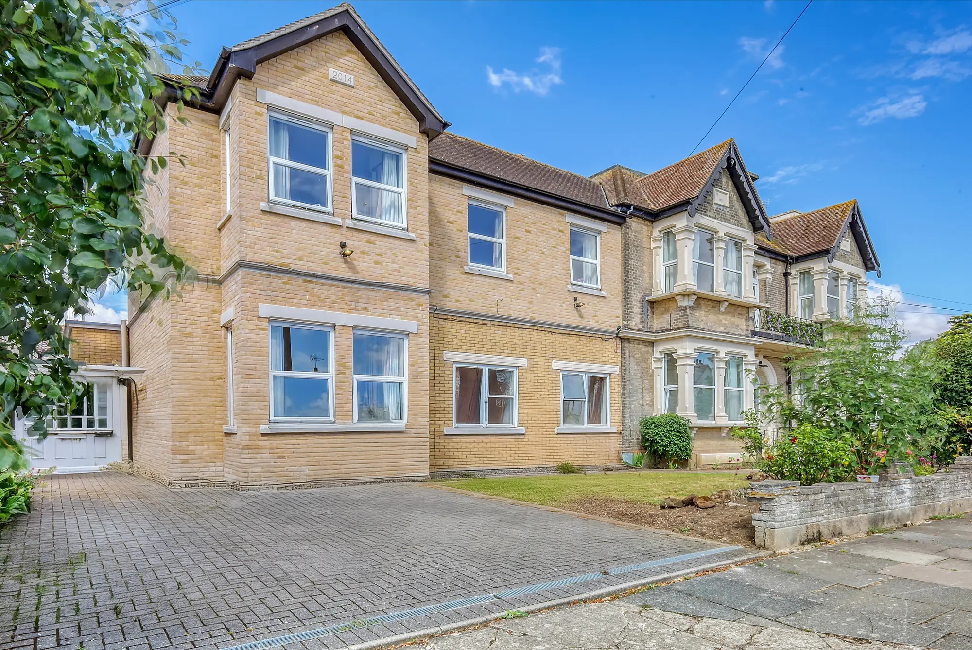 outside of house and large drive on a summers day