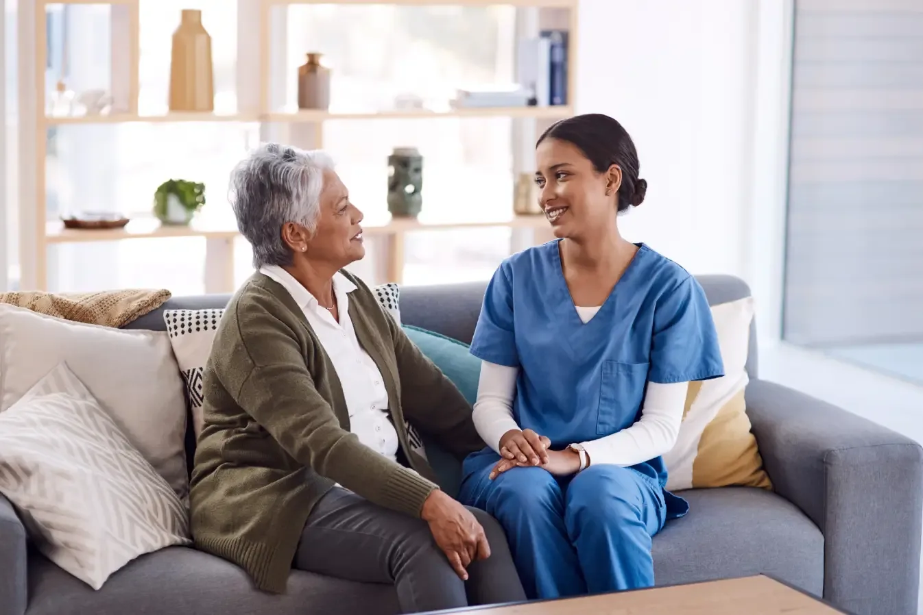 caregiver-talking-with-elderly-woman-at-home-ballagh-care