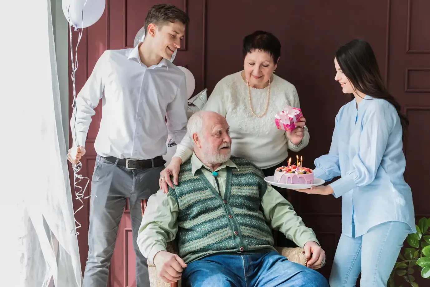 family-celebrating-with-elderly-man-in-care-home-ballagh-care