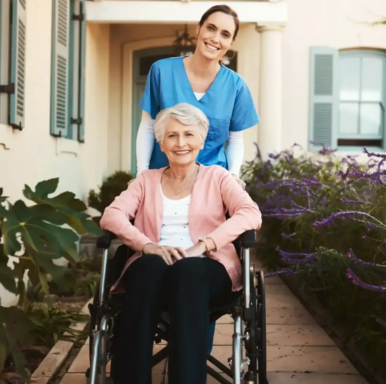 caregiver-assisting-elderly-woman-in-wheelchair-outdoors-self-funded-care-homes-essex-ballagh-care