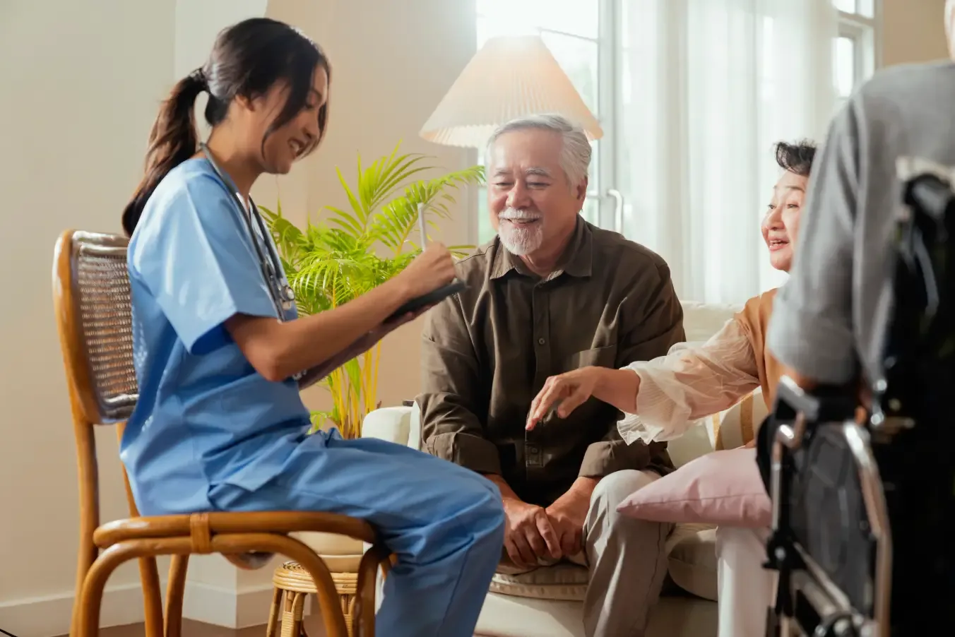 caregiver-supporting-elderly-man-in-wheelchair-ballagh-care